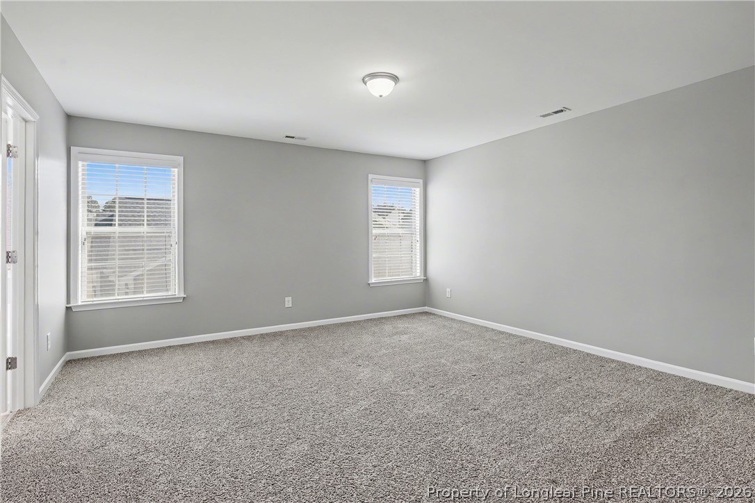 61 Bicentennial Way Cameron, NC 28326 - Photo 25 of 49 an empty room with windows