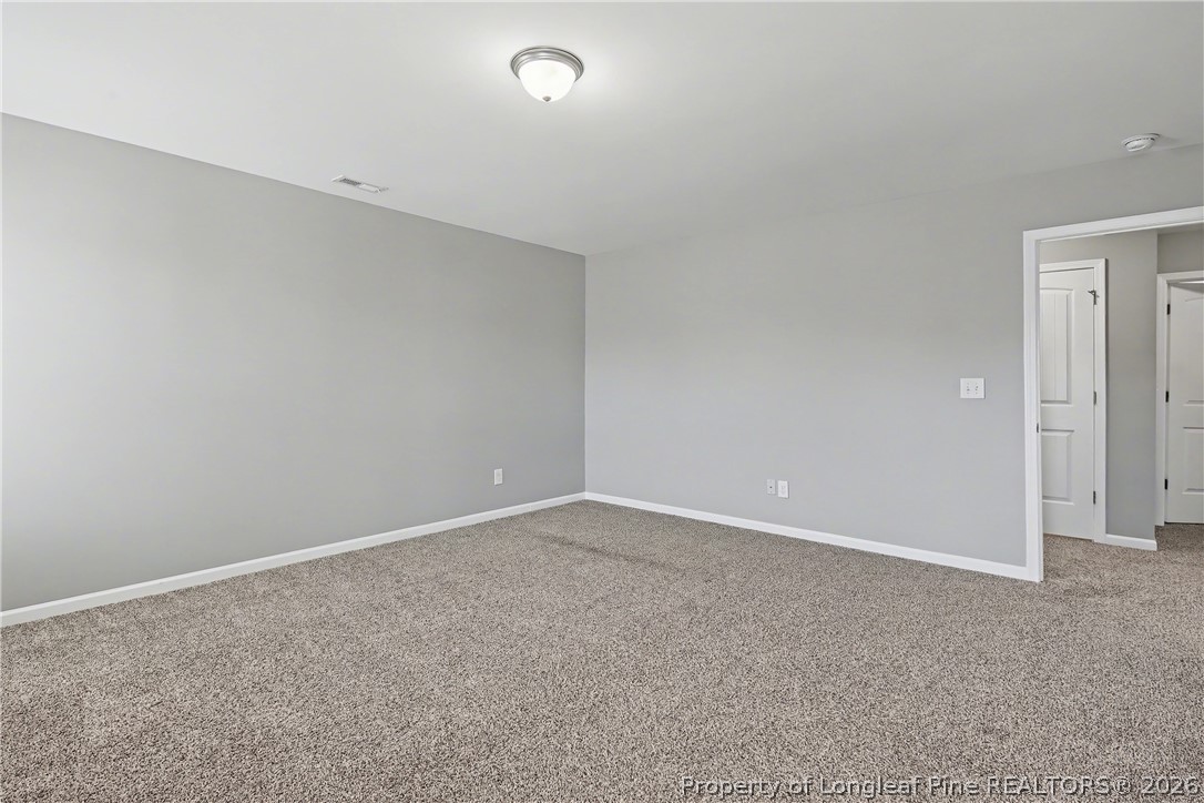 61 Bicentennial Way Cameron, NC 28326 - Photo 26 of 49 an empty room with an entryway
