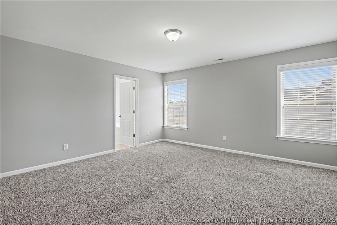 61 Bicentennial Way Cameron, NC 28326 - Photo 28 of 49 a view of an empty room with a window