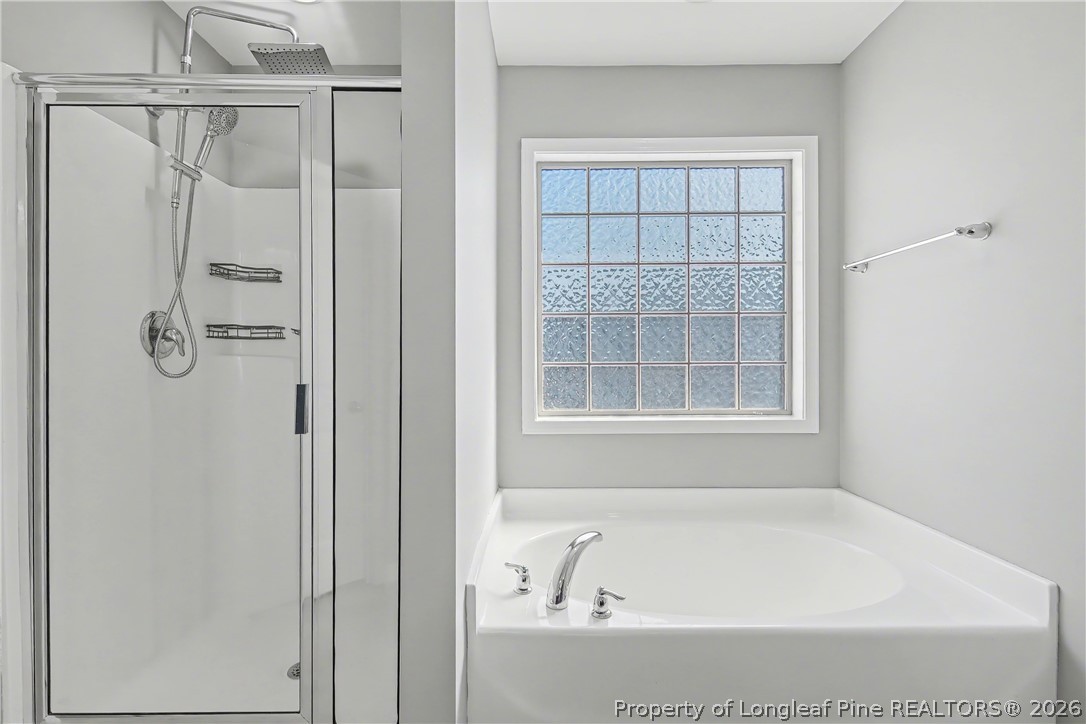 61 Bicentennial Way Cameron, NC 28326 - Photo 32 of 49 a bathroom with a bathtub and shower
