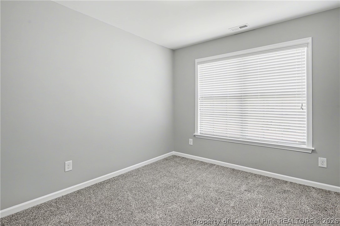 61 Bicentennial Way Cameron, NC 28326 - Photo 35 of 49 an empty room with a window