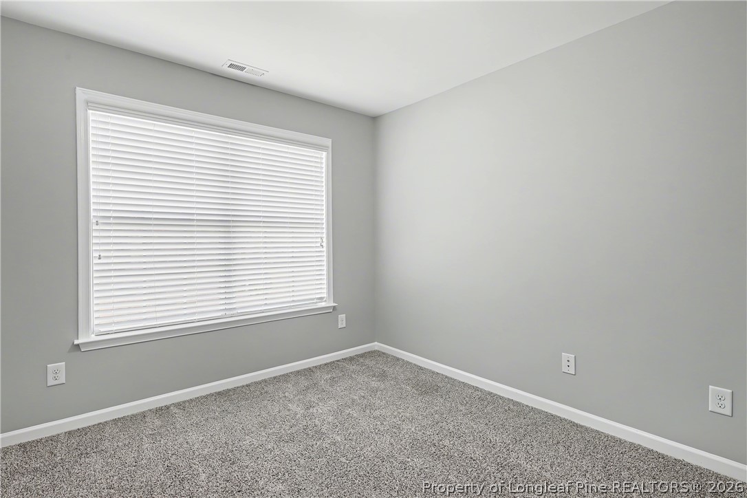 61 Bicentennial Way Cameron, NC 28326 - Photo 36 of 49 an empty room with a window