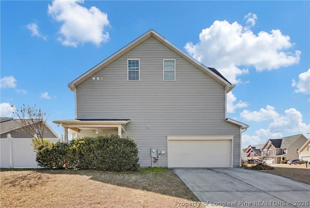 61 Bicentennial Way Cameron, NC 28326 - Photo 4 of 49 a front view of a house with a yard and garage