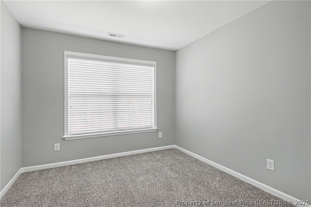61 Bicentennial Way Cameron, NC 28326 - Photo 41 of 49 an empty room with a window