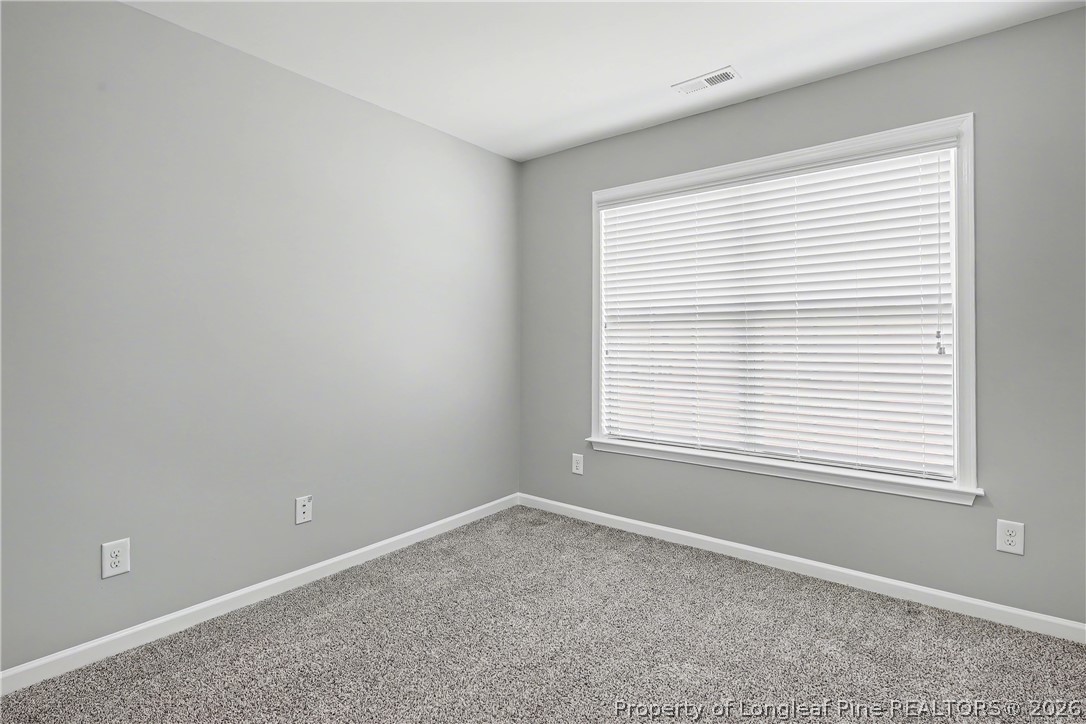 61 Bicentennial Way Cameron, NC 28326 - Photo 44 of 49 an empty room with a window