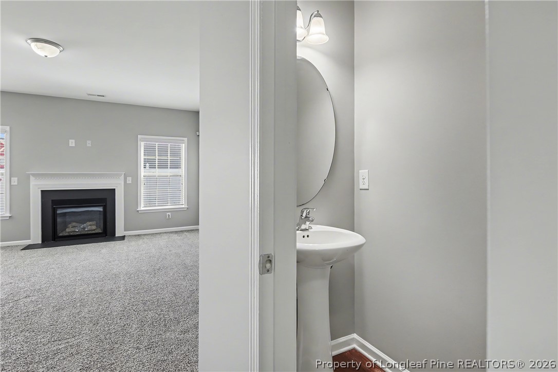 61 Bicentennial Way Cameron, NC 28326 - Photo 7 of 49 a view of a livingroom with a fireplace