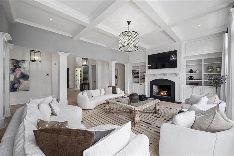 13980 Haystack Lane Milton, GA 30004 - Photo 14 of 83 a living room with furniture a fireplace and a chandelier