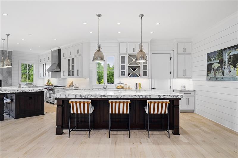 13980 Haystack Lane Milton, GA 30004 - Photo 16 of 83 a kitchen with stainless steel appliances granite countertop a kitchen island a stove and a wooden floors
