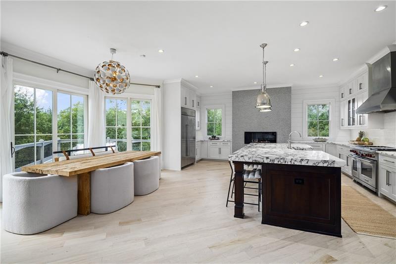 13980 Haystack Lane Milton, GA 30004 - Photo 17 of 83 a large kitchen with kitchen island a sink stainless steel appliances and a large window