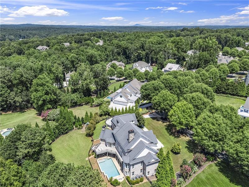 13980 Haystack Lane Milton, GA 30004 - Photo 2 of 83 an aerial view of a house with a garden and outdoor space
