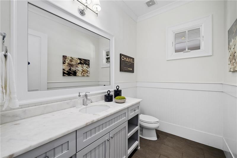13980 Haystack Lane Milton, GA 30004 - Photo 26 of 83 a bathroom with a granite countertop toilet sink and mirror