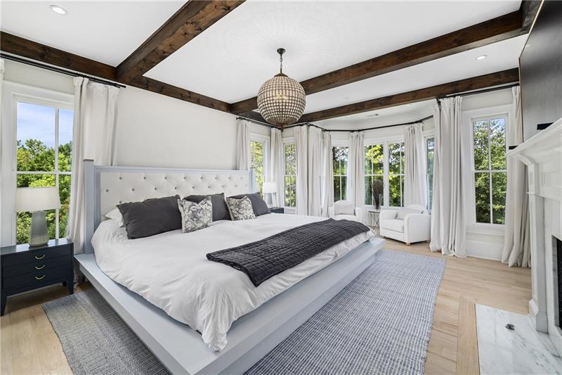 13980 Haystack Lane Milton, GA 30004 - Photo 27 of 83 a bedroom with a large bed and a chandelier
