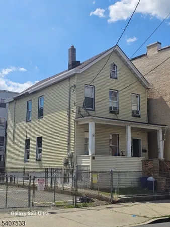 a front view of a house with garage