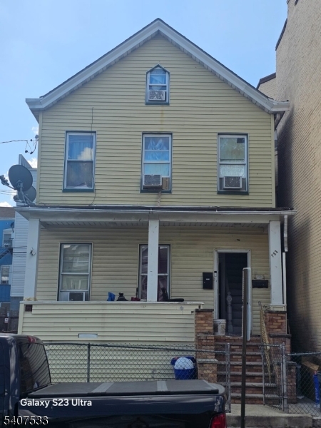 153 3rd Street Passaic, NJ 07055 - Photo 2 of 5 front view of house