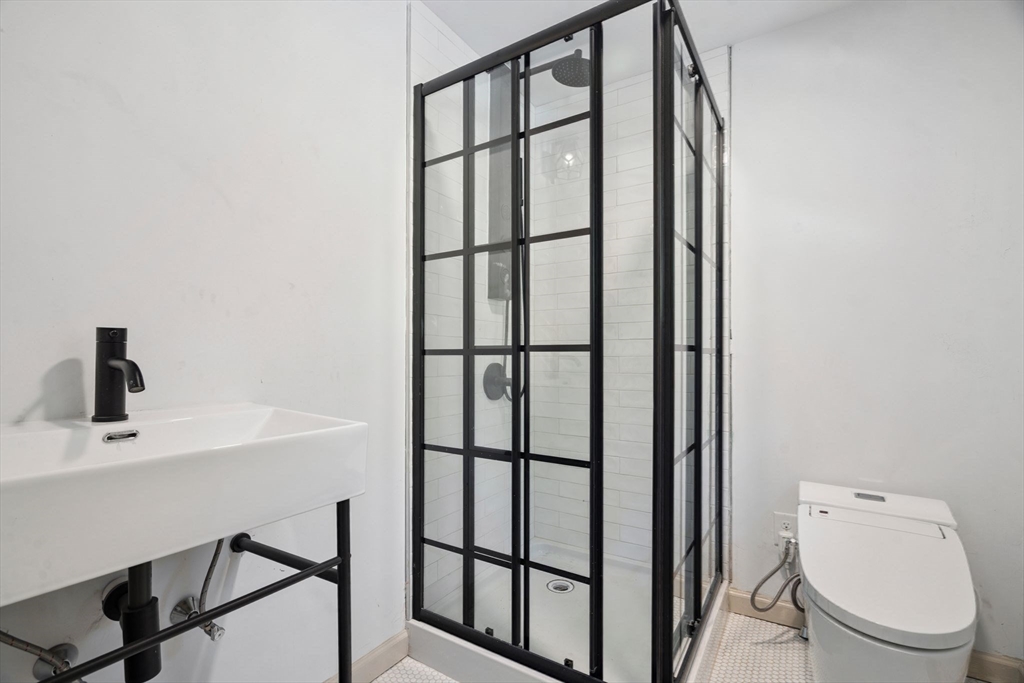 18 Chestnut Hill Road Millville, MA 01529 - Photo 20 of 26 a bathroom with a toilet a sink and mirror