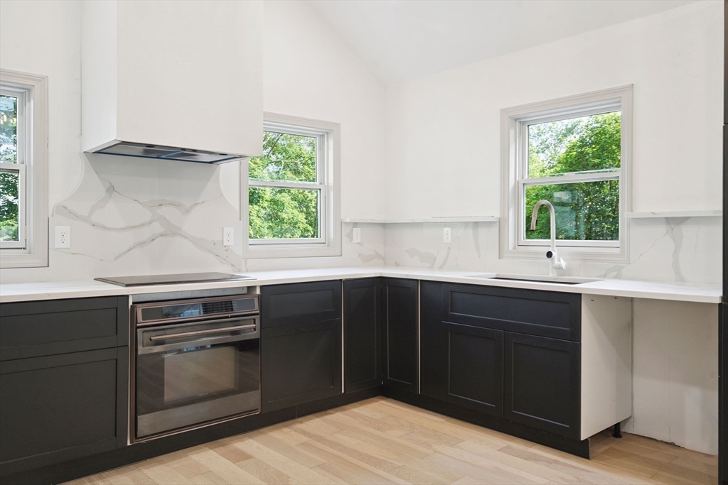 18 Chestnut Hill Road Millville, MA 01529 - Photo 3 of 26 a kitchen with a sink and window