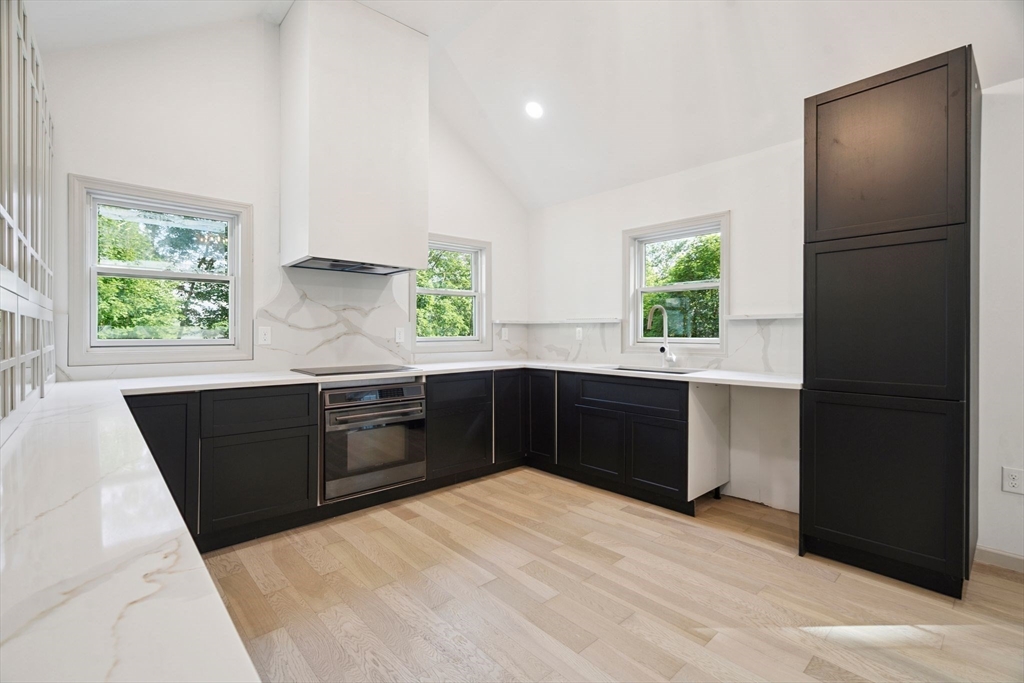 18 Chestnut Hill Road Millville, MA 01529 - Photo 4 of 26 a kitchen with a refrigerator and a sink