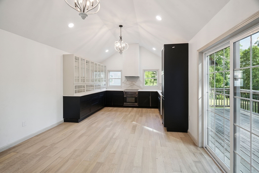 18 Chestnut Hill Road Millville, MA 01529 - Photo 7 of 26 a kitchen with kitchen island a counter top space a sink and appliances