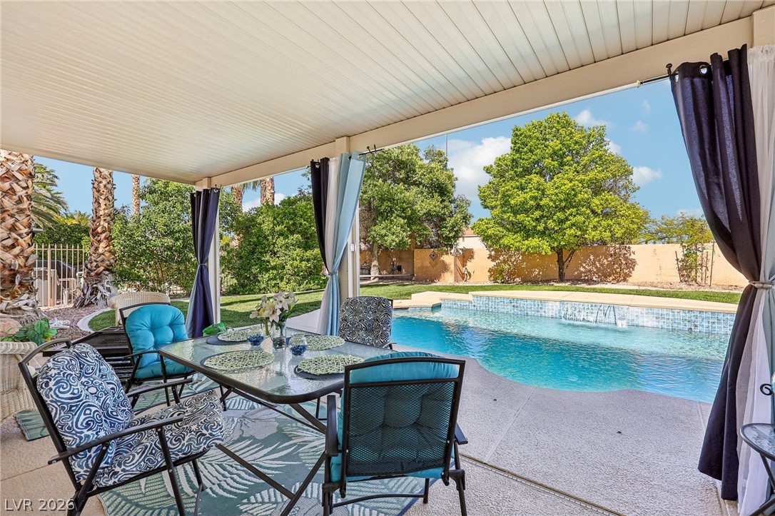 5236 Saranac Road Las Vegas, NV 89130 - Photo 47 of 52 This private backyard oasis offers a covered patio ideal for al fresco dining and poolside relaxation.