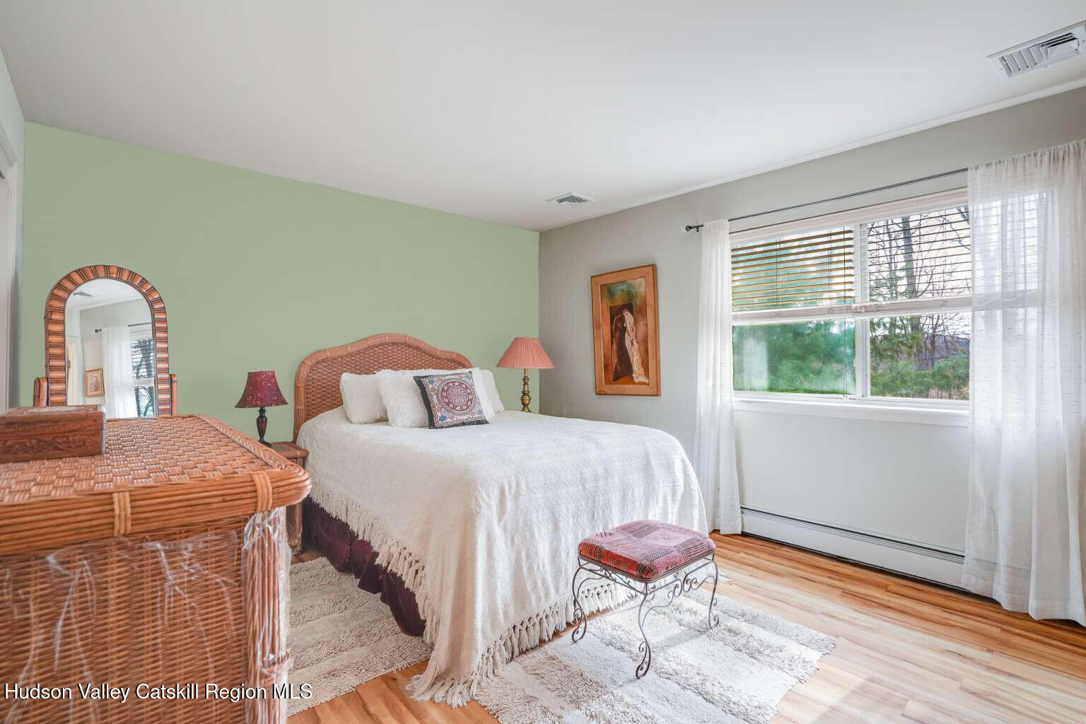 257 Bruynswick Road New Paltz, NY 12561 - Photo 13 of 23 a bed room with a bed and a chair