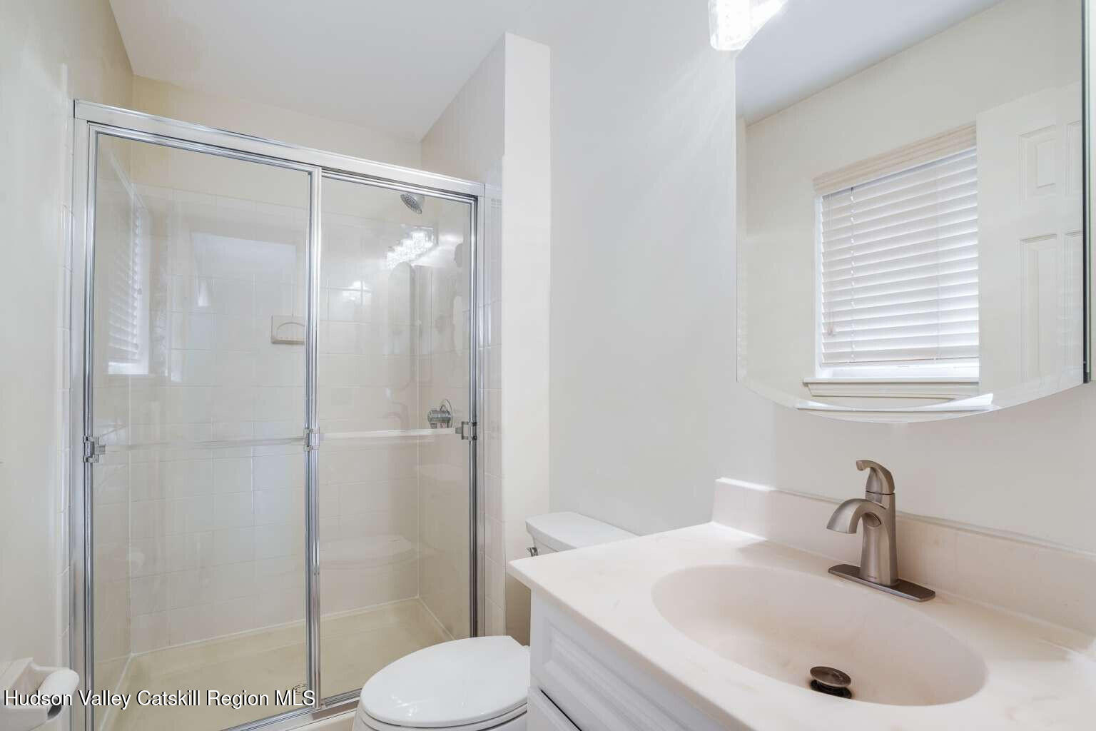257 Bruynswick Road New Paltz, NY 12561 - Photo 14 of 23 a bathroom with a sink toilet and shower