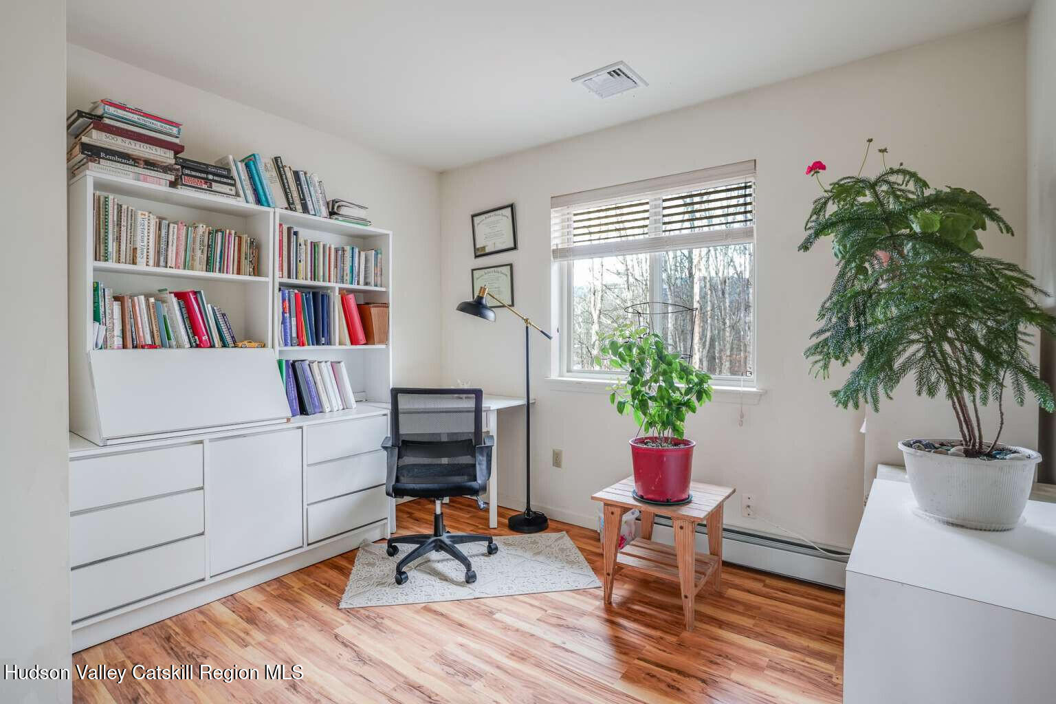 257 Bruynswick Road New Paltz, NY 12561 - Photo 17 of 23 a living room with furniture and a book shelf