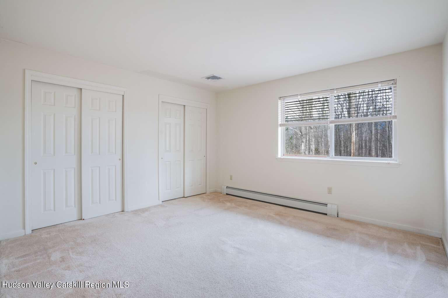 257 Bruynswick Road New Paltz, NY 12561 - Photo 21 of 23 a view of an empty room with a window