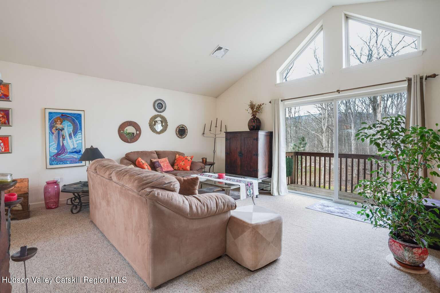 257 Bruynswick Road New Paltz, NY 12561 - Photo 6 of 23 a living room with furniture and a large window