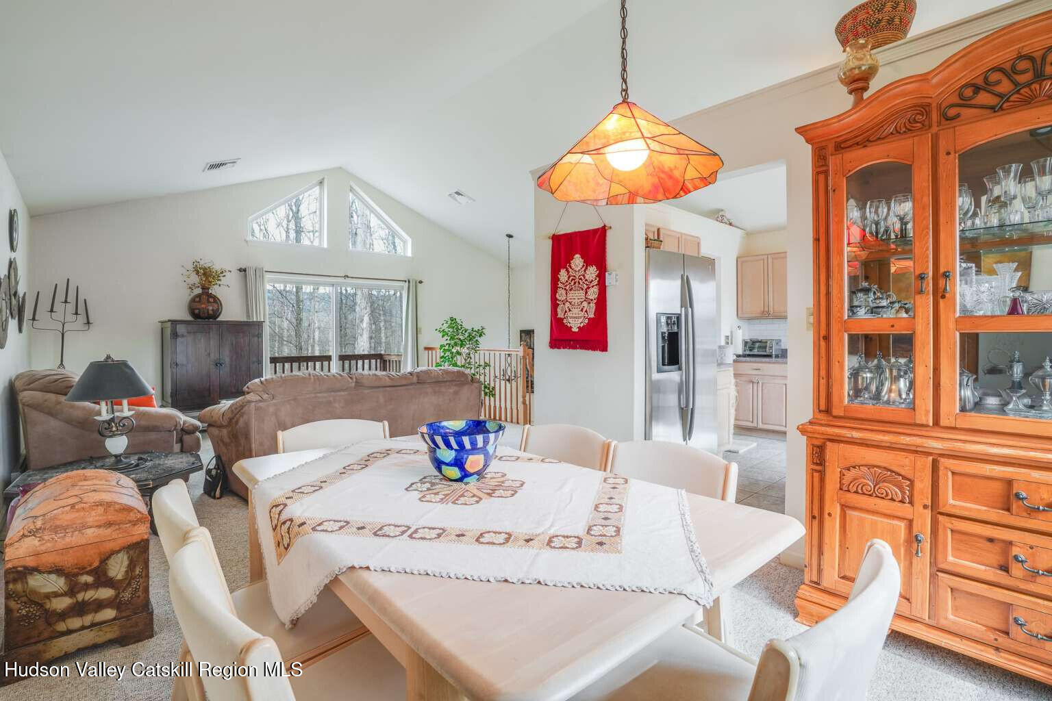 257 Bruynswick Road New Paltz, NY 12561 - Photo 8 of 23 a view of a dining room with furniture and a chandelier