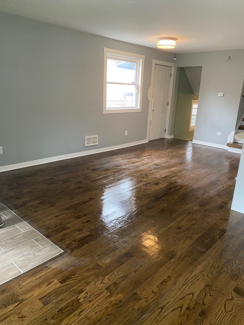 6732 South Peoria Street Chicago, IL 60621 - Photo 7 of 16 a view of empty room with wooden floor