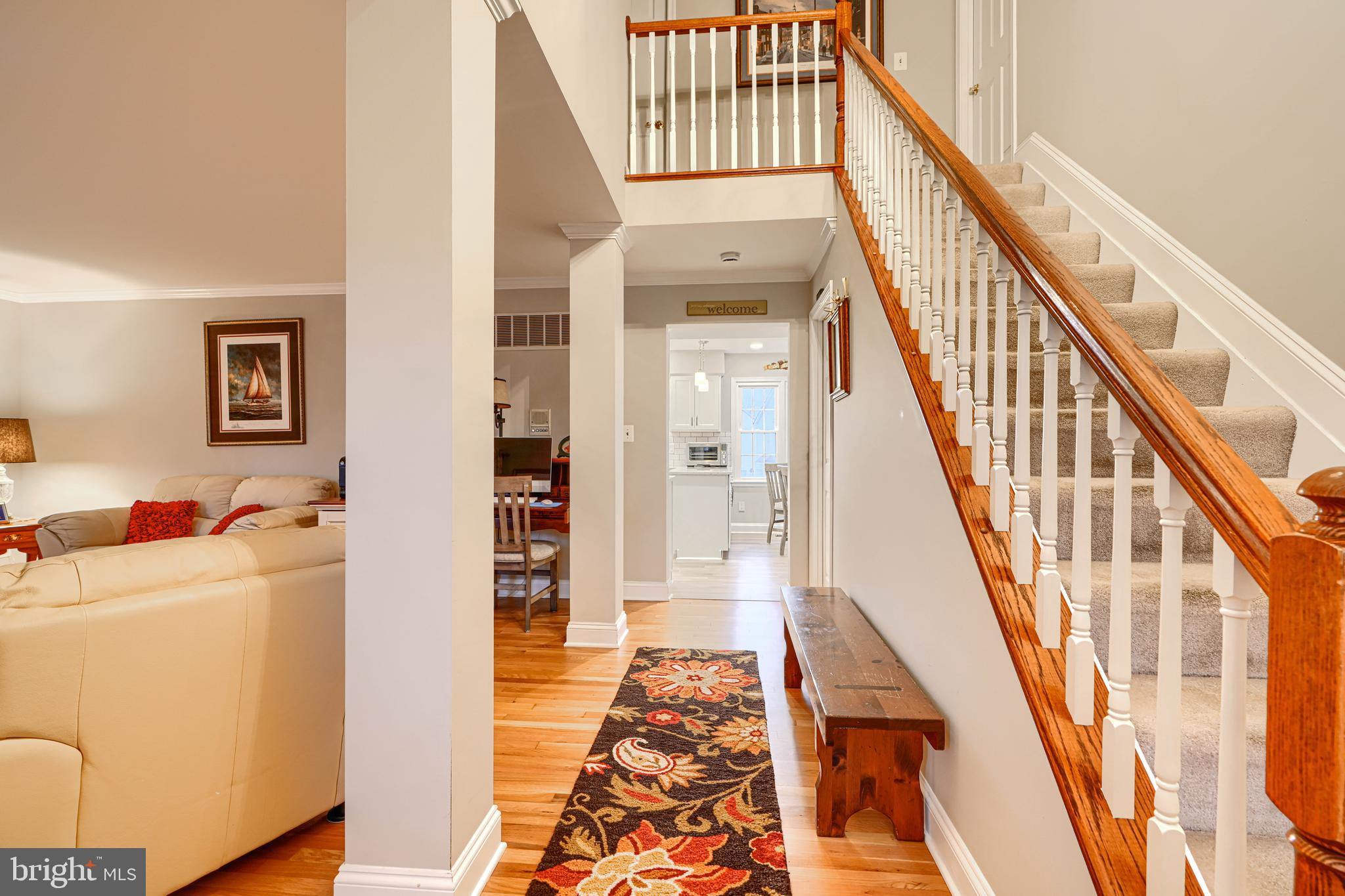 3 Horn Point Court Baltimore, MD 21234 - Photo 11 of 83 a view of a livingroom with wooden floor and stairs