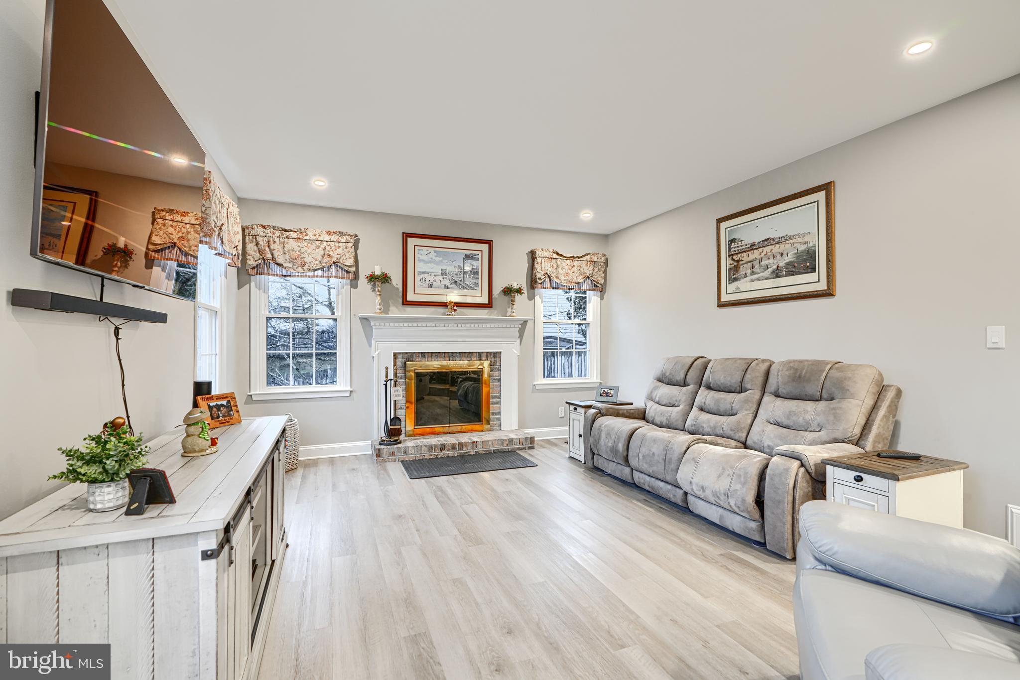 3 Horn Point Court Baltimore, MD 21234 - Photo 20 of 83 a living room with furniture and a fireplace