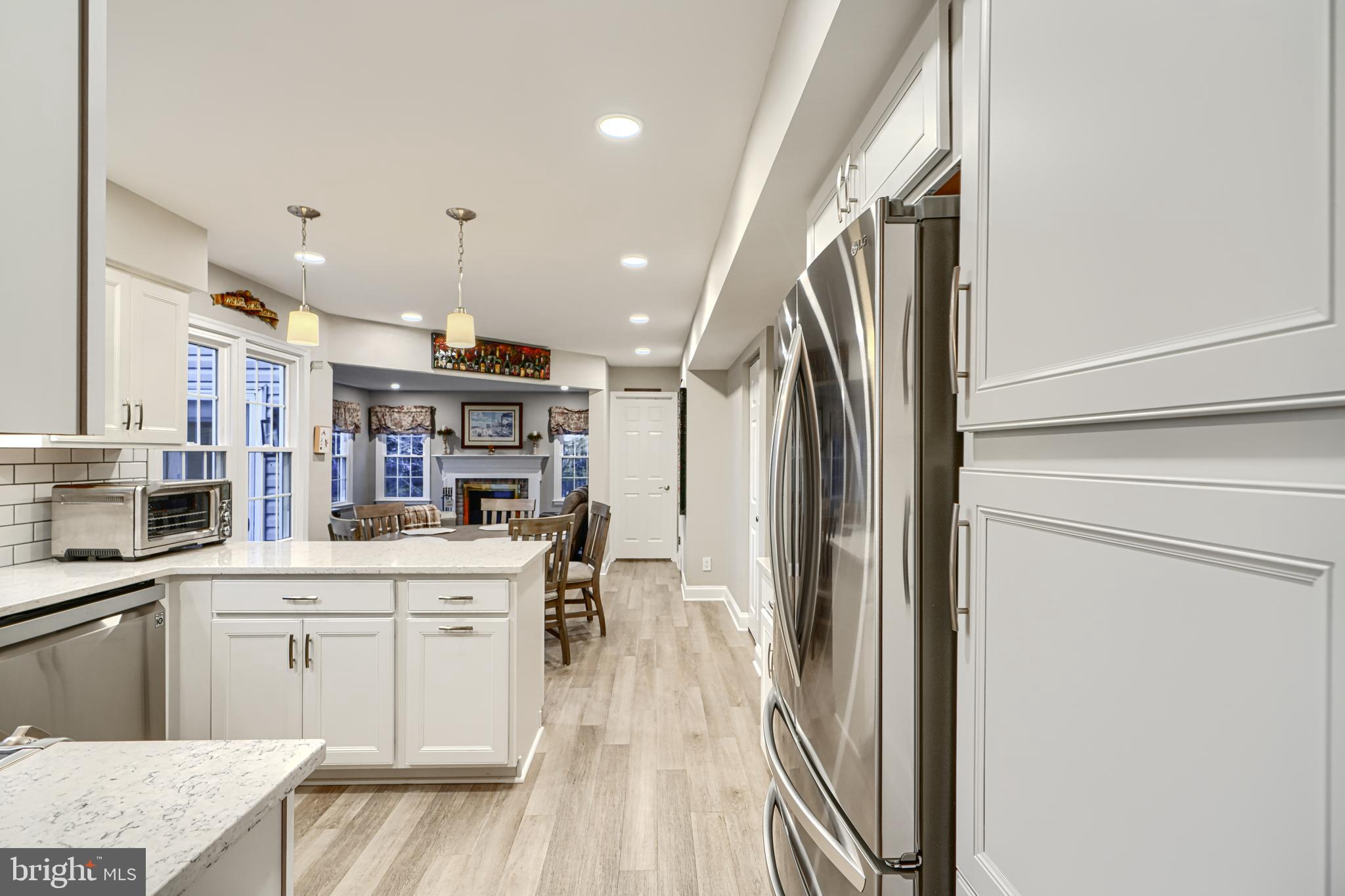 3 Horn Point Court Baltimore, MD 21234 - Photo 28 of 83 a kitchen with stainless steel appliances a refrigerator and a stove top oven