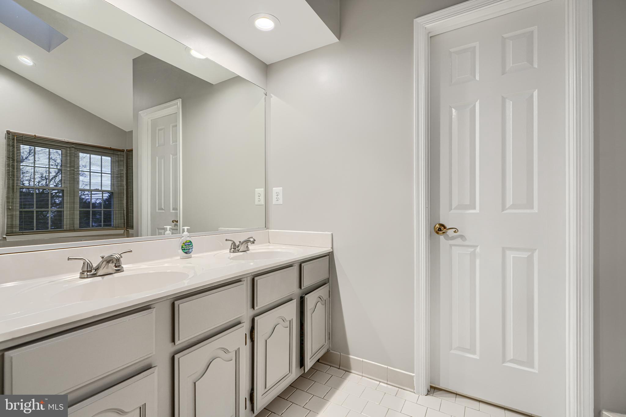 3 Horn Point Court Baltimore, MD 21234 - Photo 42 of 83 a bathroom with 2 sink and a mirror