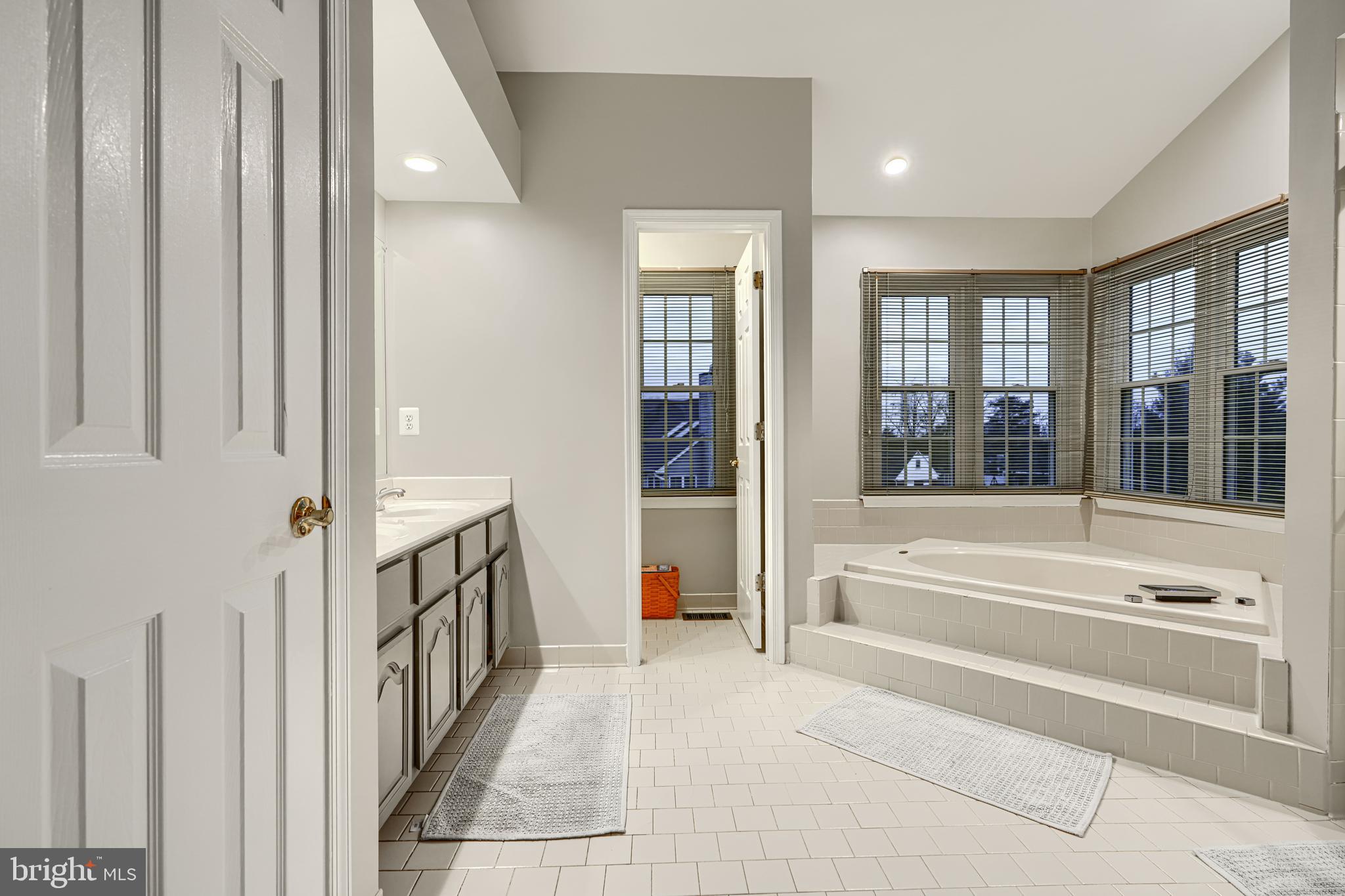 3 Horn Point Court Baltimore, MD 21234 - Photo 45 of 83 a spacious en suite bathroom with a tub and window