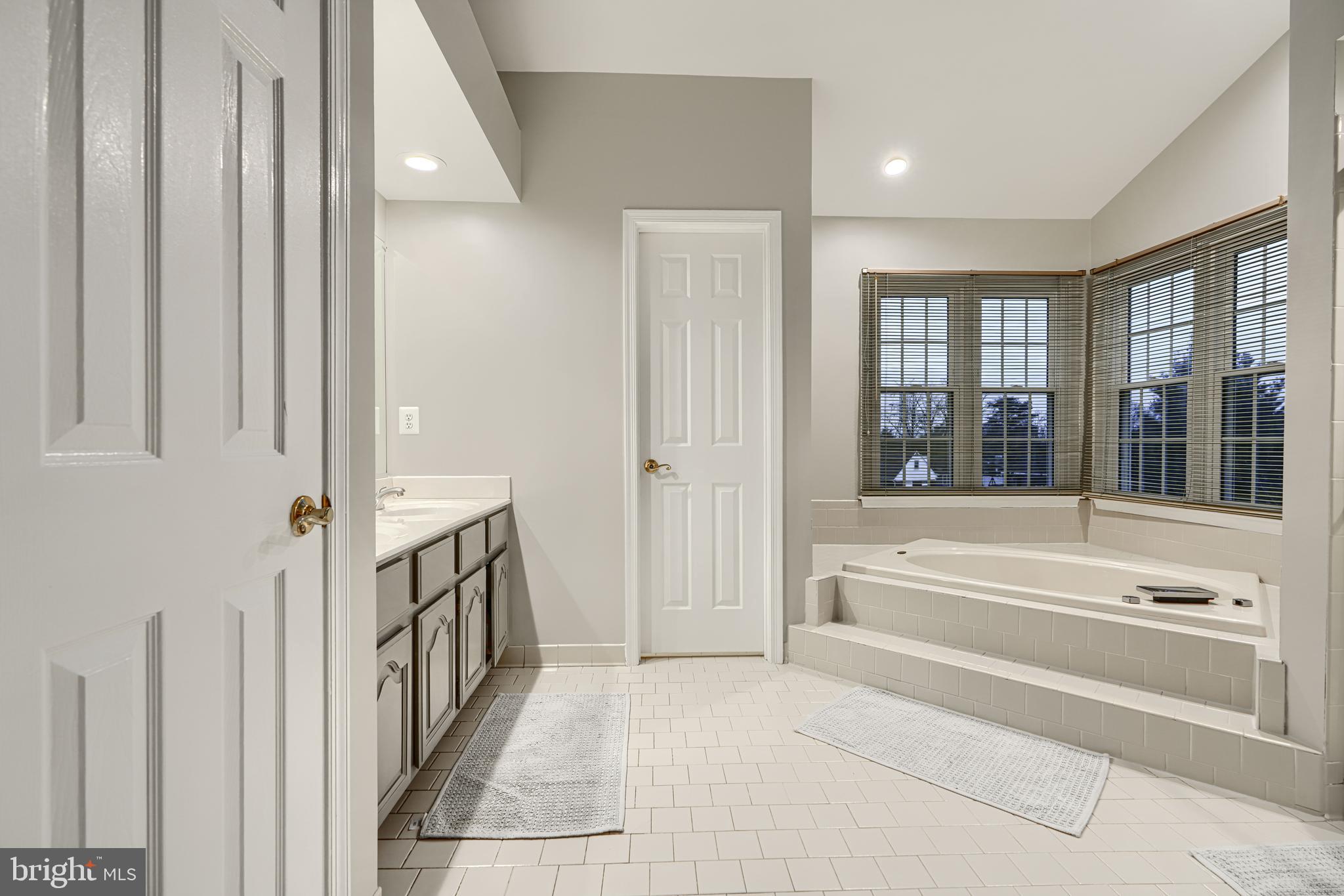 3 Horn Point Court Baltimore, MD 21234 - Photo 46 of 83 a spacious bathroom with a tub and shower
