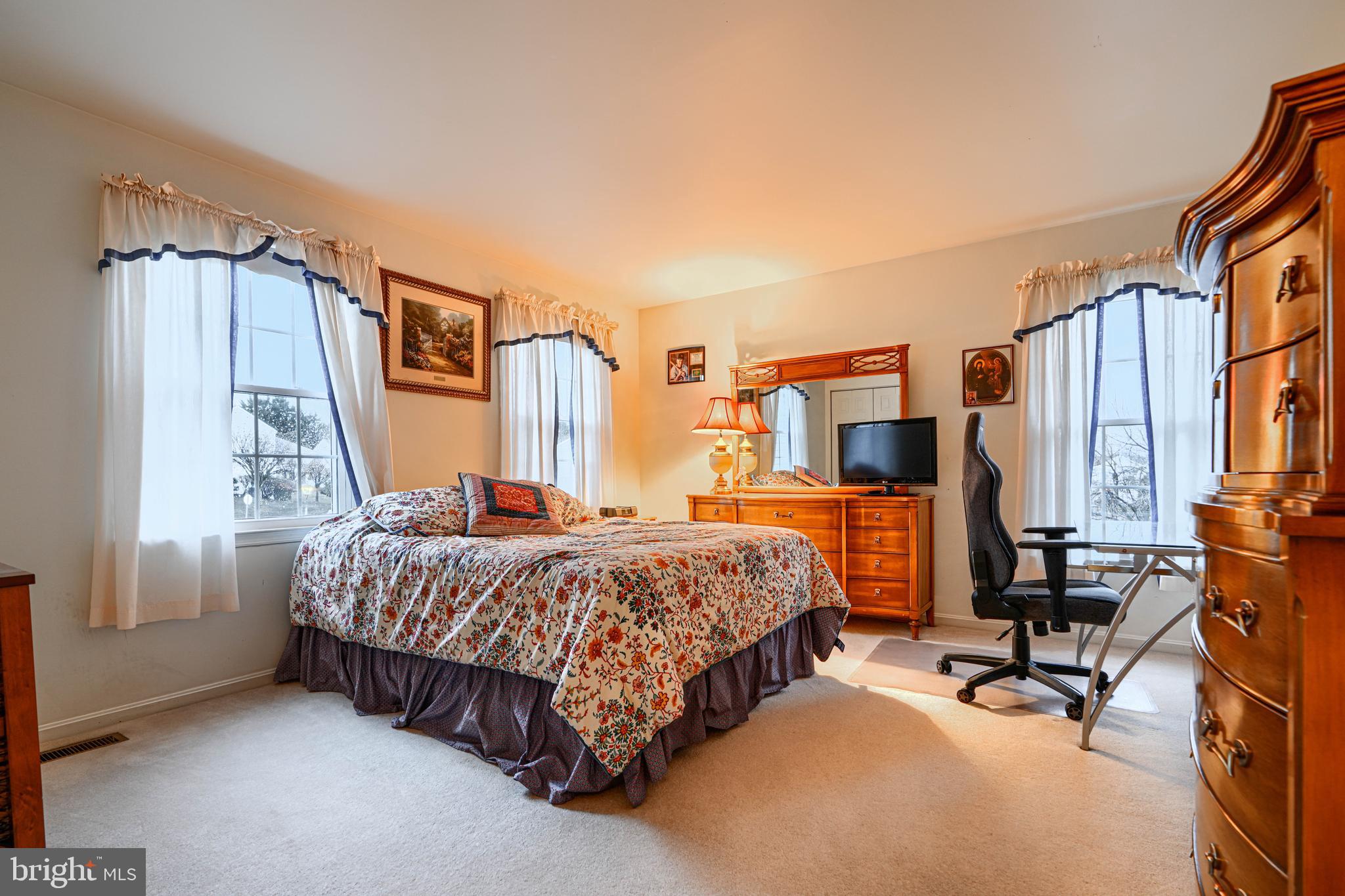 3 Horn Point Court Baltimore, MD 21234 - Photo 47 of 83 a bedroom with a bed and a table