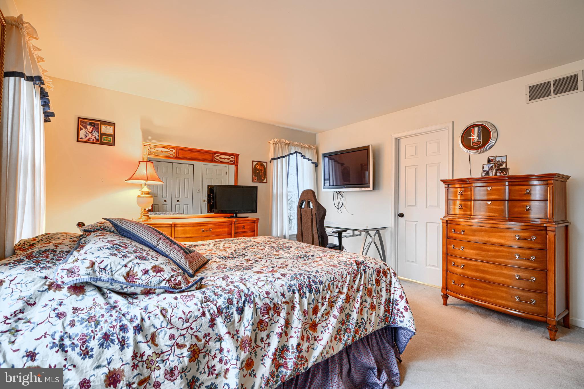 3 Horn Point Court Baltimore, MD 21234 - Photo 48 of 83 a bedroom with a bed and a dresser