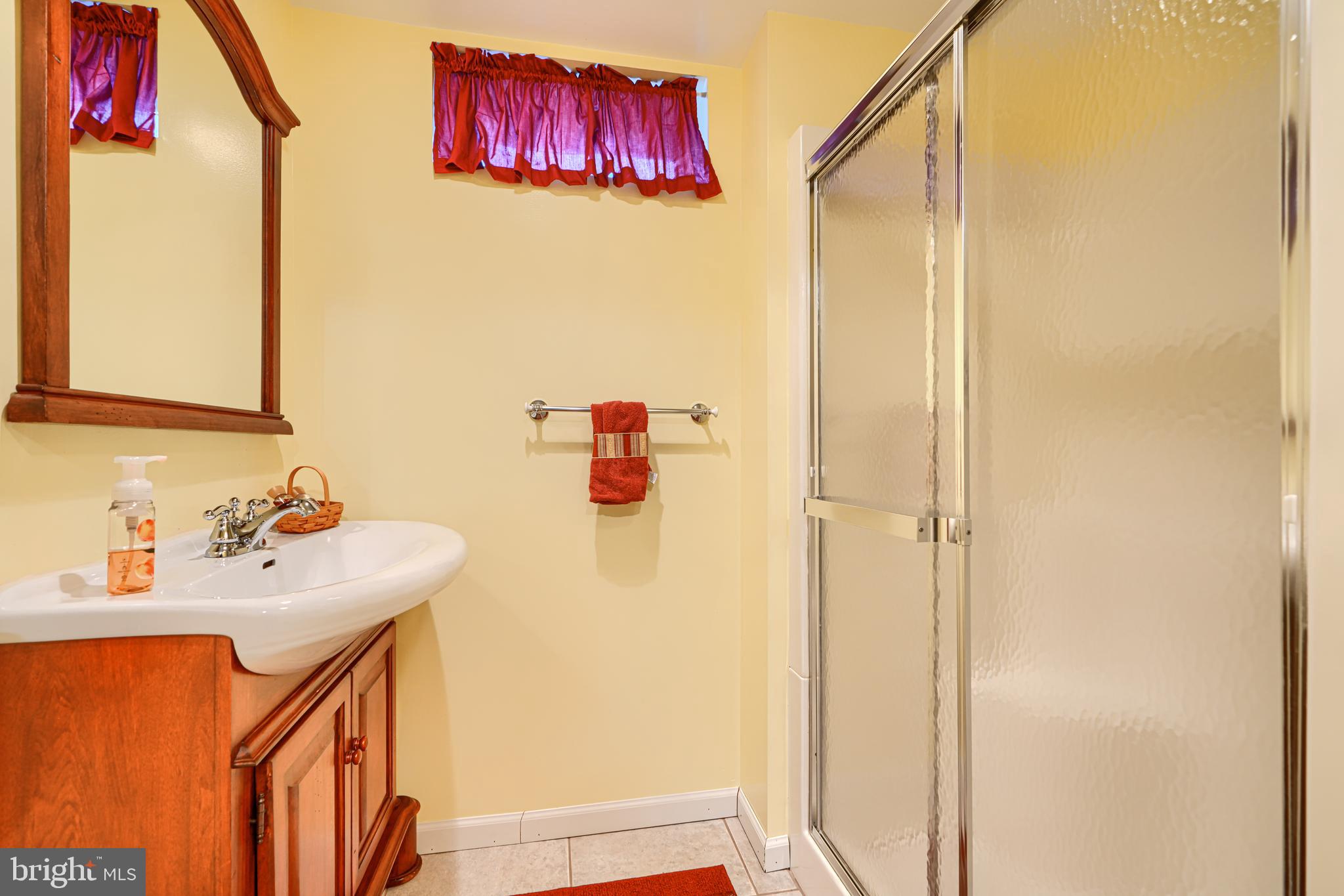 3 Horn Point Court Baltimore, MD 21234 - Photo 68 of 83 a bathroom with a sink and a mirror