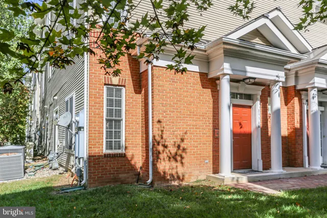 front view of a house with a tree