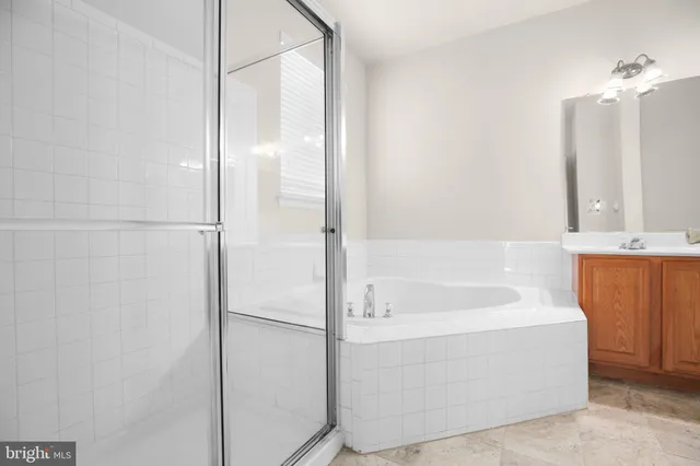 a bathroom with a bathtub and a sink