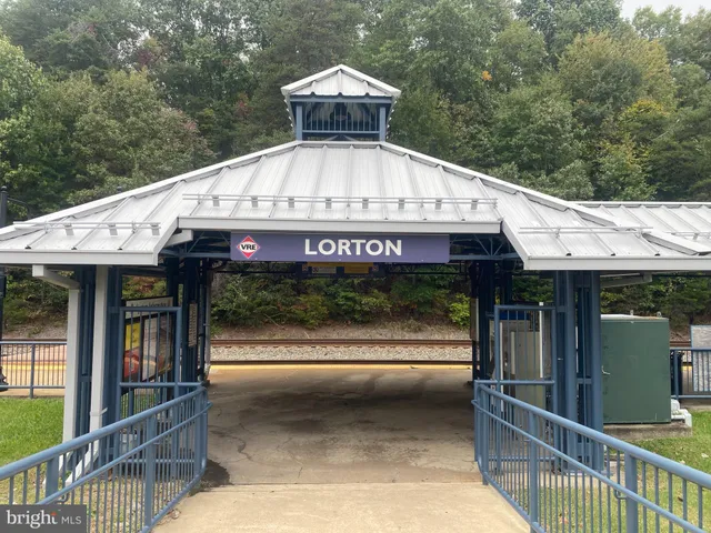 a front view of a house with a porch and furniture