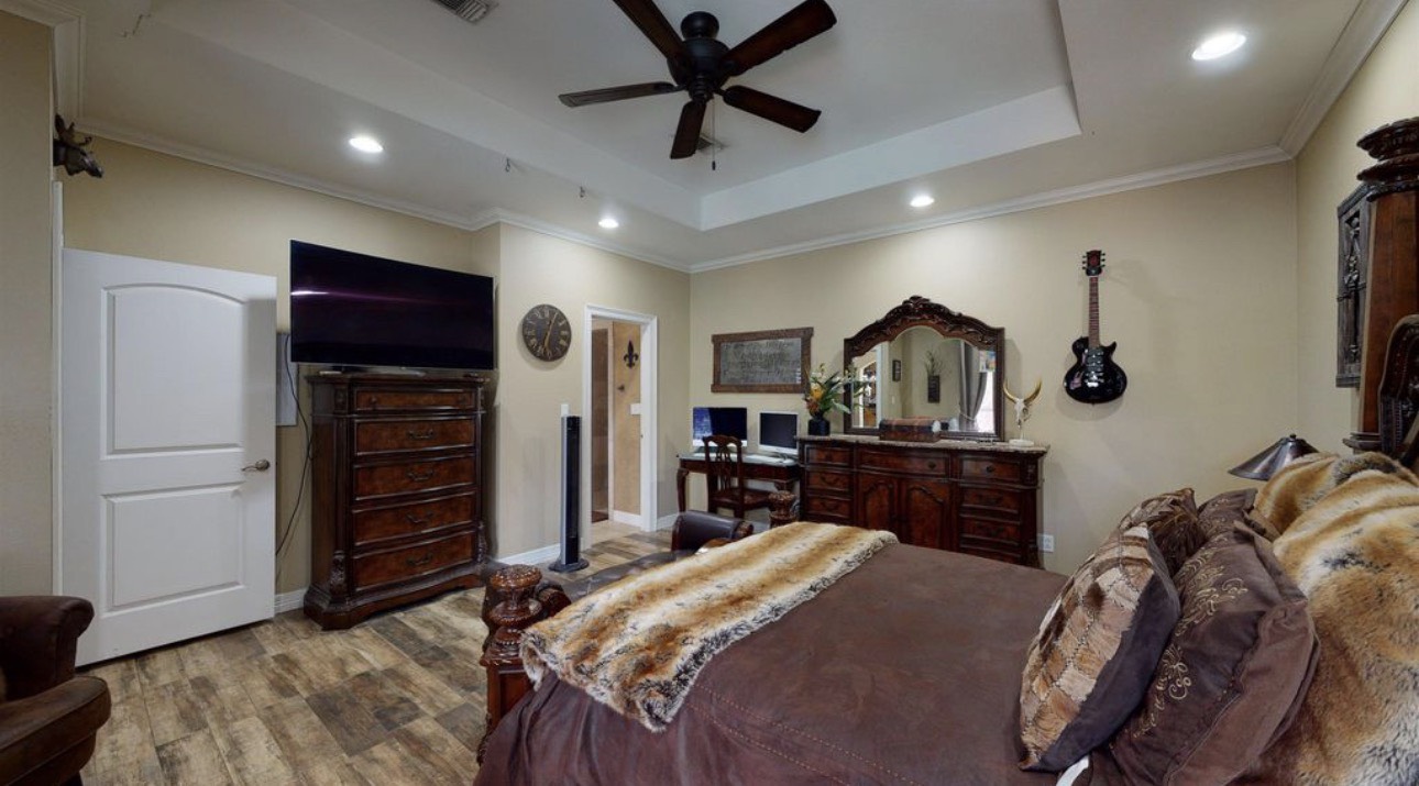 104 Mockingbird Lane Bridge City, TX 77611 - Photo 18 of 27 a bed room with a bed and a television