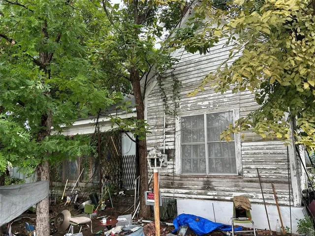 a view of house with yard