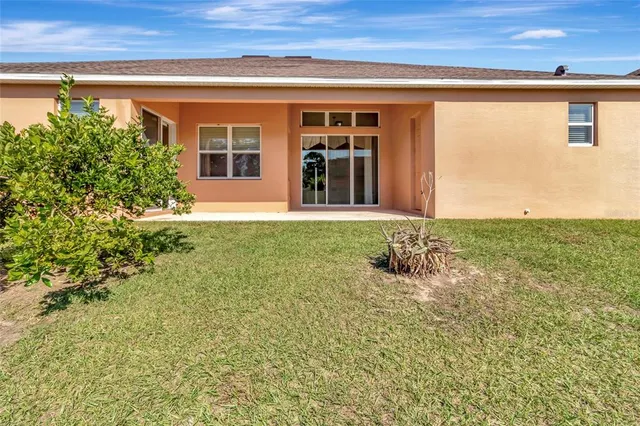 an aerial view of a house with a swimming pool