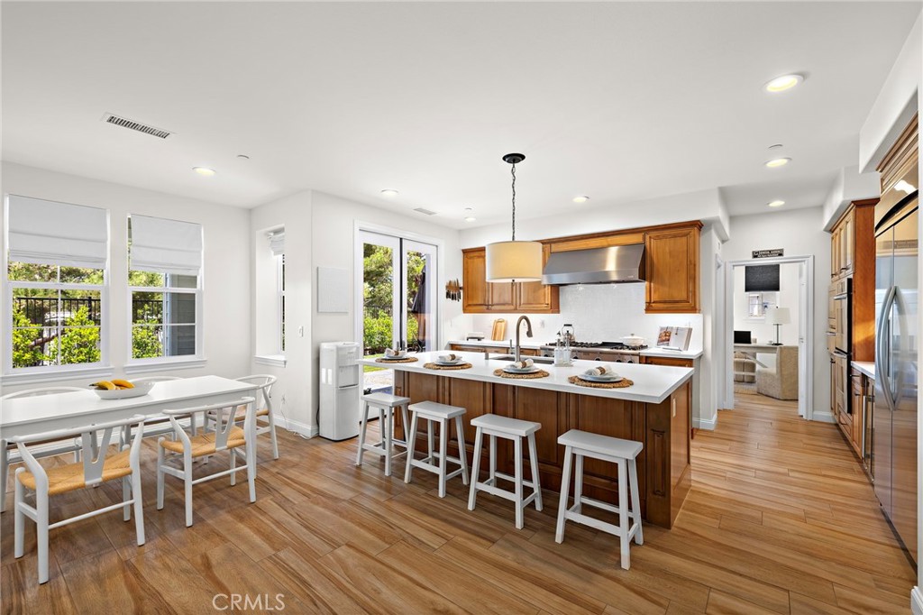 3 Tranquility Place Ladera Ranch, CA 92694 - Photo 16 of 63 a large kitchen with a table and chairs