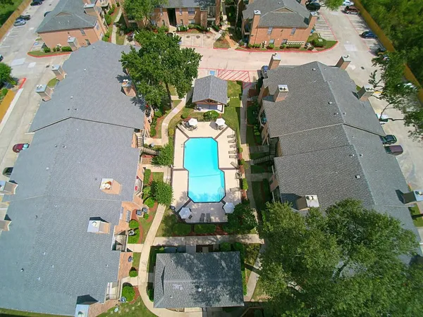 an aerial view of a house with outdoor space