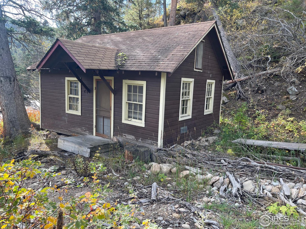 2203 Riverside Drive Lyons, CO 80540 - Photo 3 of 16 a view of a house with a yard