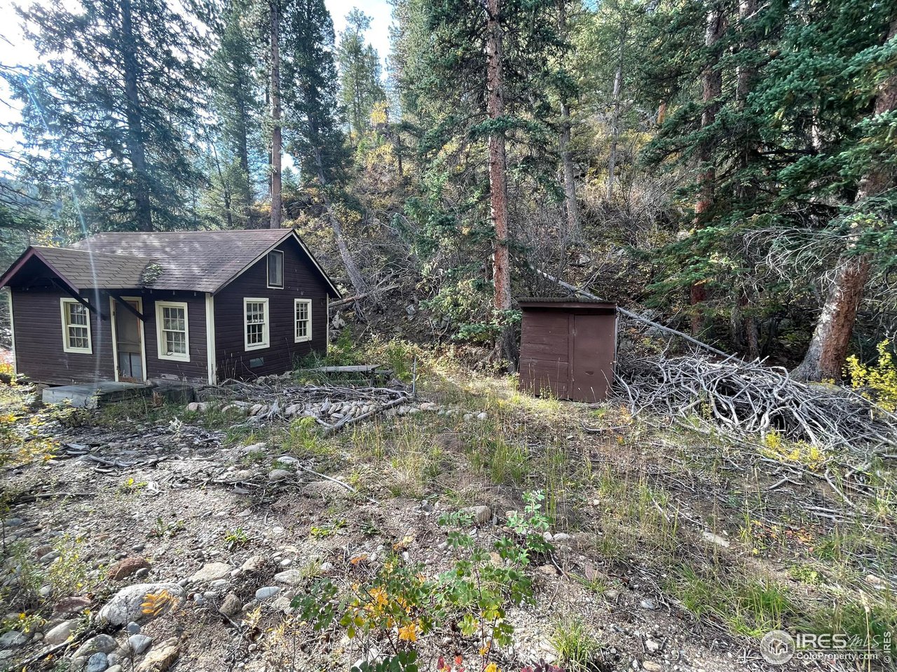 2203 Riverside Drive Lyons, CO 80540 - Photo 9 of 16 a front view of a house with garden