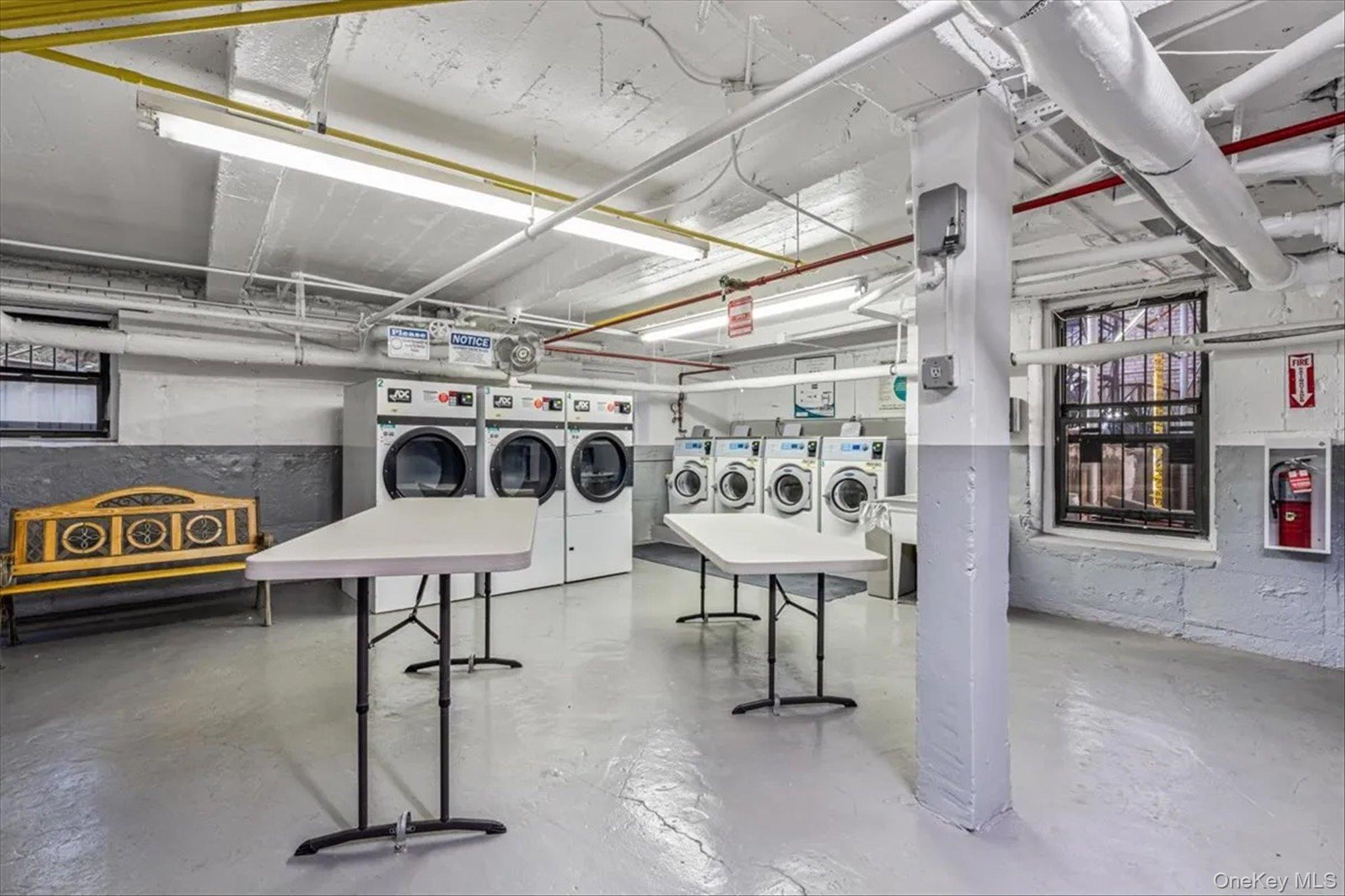 72-34 Austin Street, Unit F10 Queens, NY 11375 - Photo 14 of 15 Unfinished below grade area featuring washer and clothes dryer